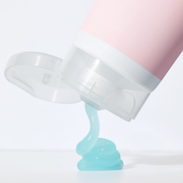 Mary Kay After-Sun Replenishing Gel being squeezed onto a white surface
